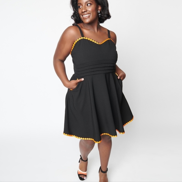 Black fit and flare dress with pumpkin trim - Picture 2 of 6